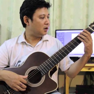 Tư thế ngồi chơi đàn guitar